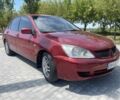 Червоний Міцубісі Lancer, об'ємом двигуна 1.6 л та пробігом 250 тис. км за 3300 $, фото 1 на Automoto.ua