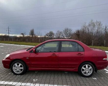 Красный Мицубиси Лансер, объемом двигателя 1.6 л и пробегом 176 тыс. км за 4300 $, фото 4 на Automoto.ua