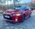 Червоний Міцубісі Lancer, об'ємом двигуна 2 л та пробігом 243 тис. км за 6000 $, фото 1 на Automoto.ua