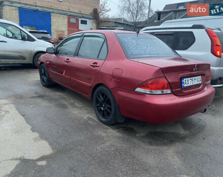 Красный Мицубиси Лансер, объемом двигателя 1.58 л и пробегом 269 тыс. км за 3899 $, фото 3 на Automoto.ua