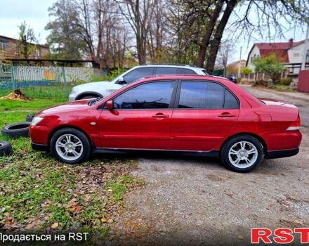 Червоний Міцубісі Lancer, об'ємом двигуна 1.6 л та пробігом 216 тис. км за 4500 $, фото 5 на Automoto.ua