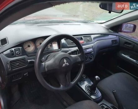 Красный Мицубиси Лансер, объемом двигателя 1.6 л и пробегом 250 тыс. км за 3700 $, фото 7 на Automoto.ua