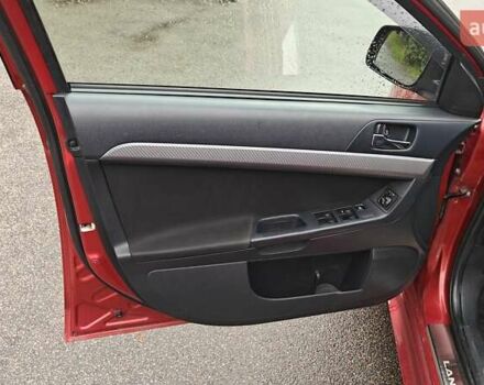 Червоний Міцубісі Lancer, об'ємом двигуна 2 л та пробігом 186 тис. км за 5600 $, фото 17 на Automoto.ua