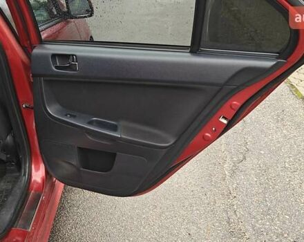 Червоний Міцубісі Lancer, об'ємом двигуна 2 л та пробігом 186 тис. км за 5600 $, фото 24 на Automoto.ua