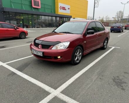 Красный Мицубиси Лансер, объемом двигателя 1.6 л и пробегом 285 тыс. км за 3650 $, фото 2 на Automoto.ua