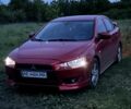 Красный Мицубиси Лансер, объемом двигателя 2 л и пробегом 254 тыс. км за 6500 $, фото 1 на Automoto.ua