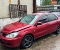 Красный Мицубиси Лансер, объемом двигателя 1.58 л и пробегом 200 тыс. км за 1450 $, фото 1 на Automoto.ua