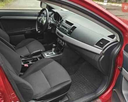 Червоний Міцубісі Lancer, об'ємом двигуна 2 л та пробігом 186 тис. км за 5600 $, фото 18 на Automoto.ua