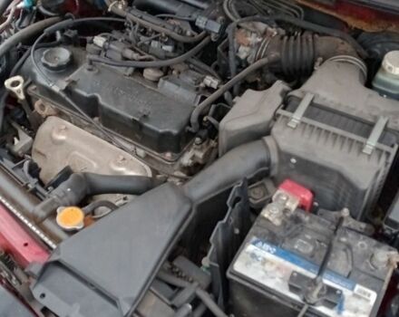 Красный Мицубиси Лансер, объемом двигателя 1.6 л и пробегом 155 тыс. км за 2000 $, фото 2 на Automoto.ua