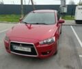 Красный Мицубиси Лансер, объемом двигателя 1 л и пробегом 230 тыс. км за 6025 $, фото 1 на Automoto.ua