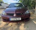 Красный Мицубиси Лансер, объемом двигателя 2 л и пробегом 3 тыс. км за 5800 $, фото 13 на Automoto.ua