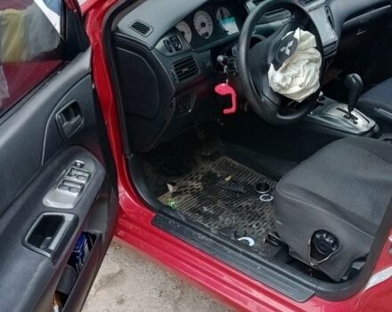 Красный Мицубиси Лансер, объемом двигателя 1.6 л и пробегом 155 тыс. км за 2000 $, фото 3 на Automoto.ua