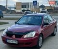 Красный Мицубиси Лансер, объемом двигателя 1.58 л и пробегом 283 тыс. км за 2750 $, фото 1 на Automoto.ua