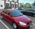 Красный Мицубиси Лансер, объемом двигателя 1.6 л и пробегом 222 тыс. км за 4150 $, фото 1 на Automoto.ua