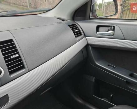 Червоний Міцубісі Lancer, об'ємом двигуна 2 л та пробігом 186 тис. км за 5600 $, фото 13 на Automoto.ua