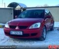 Красный Мицубиси Лансер, объемом двигателя 1.6 л и пробегом 22000 тыс. км за 3850 $, фото 1 на Automoto.ua