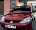 Червоний Міцубісі Lancer, об'ємом двигуна 1.6 л та пробігом 219 тис. км за 4700 $, фото 1 на Automoto.ua