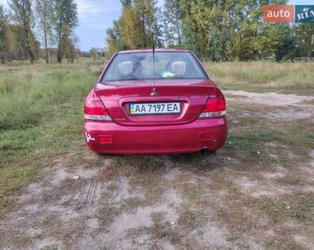 Красный Мицубиси Лансер, объемом двигателя 1.58 л и пробегом 264 тыс. км за 3900 $, фото 3 на Automoto.ua