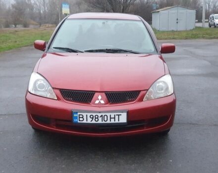 Красный Мицубиси Лансер, объемом двигателя 1.6 л и пробегом 250 тыс. км за 3700 $, фото 1 на Automoto.ua