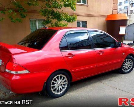Красный Мицубиси Лансер, объемом двигателя 1.6 л и пробегом 255 тыс. км за 4600 $, фото 3 на Automoto.ua