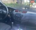 Красный Мицубиси Лансер, объемом двигателя 1.6 л и пробегом 210 тыс. км за 4200 $, фото 9 на Automoto.ua