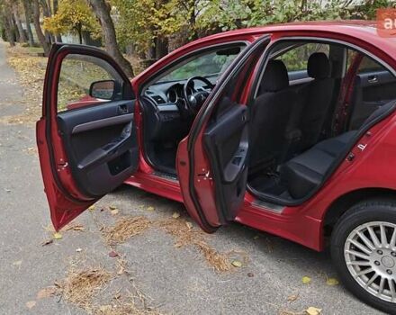 Міцубісі Lancer 2007 у Києві на Automoto.ua Червоний Міцубісі Lancer, об'ємом двигуна 2 л та пробігом 186 тис. км за 5600 $, фото 14 на Automoto.ua
