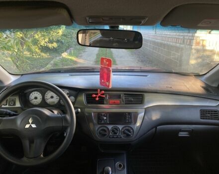 Красный Мицубиси Лансер, объемом двигателя 1.6 л и пробегом 277 тыс. км за 3299 $, фото 7 на Automoto.ua