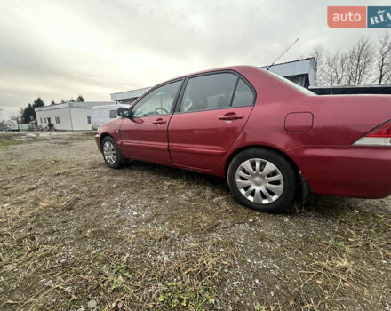 Красный Мицубиси Лансер, объемом двигателя 1.58 л и пробегом 280 тыс. км за 3250 $, фото 5 на Automoto.ua