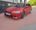Червоний Міцубісі Lancer, об'ємом двигуна 2 л та пробігом 156 тис. км за 6999 $, фото 1 на Automoto.ua