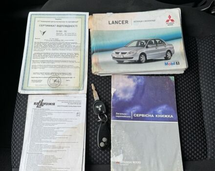 Красный Мицубиси Лансер, объемом двигателя 1.6 л и пробегом 285 тыс. км за 3650 $, фото 16 на Automoto.ua