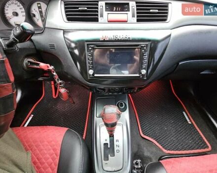 Червоний Міцубісі Lancer, об'ємом двигуна 1.6 л та пробігом 267 тис. км за 2999 $, фото 15 на Automoto.ua