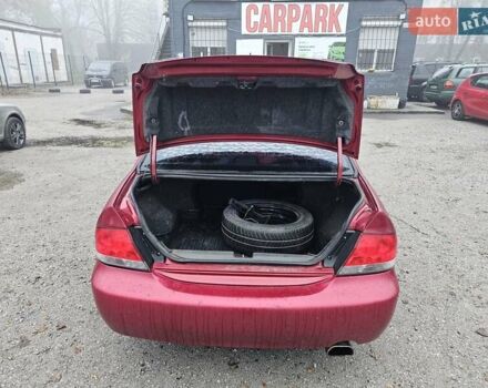 Червоний Міцубісі Lancer, об'ємом двигуна 1.6 л та пробігом 267 тис. км за 2999 $, фото 11 на Automoto.ua