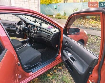 Красный Мицубиси Лансер, объемом двигателя 1.6 л и пробегом 214 тыс. км за 5000 $, фото 3 на Automoto.ua