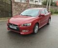 Червоний Міцубісі Lancer, об'ємом двигуна 2 л та пробігом 186 тис. км за 5600 $, фото 1 на Automoto.ua