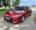 Червоний Міцубісі Lancer, об'ємом двигуна 2 л та пробігом 240 тис. км за 6300 $, фото 1 на Automoto.ua