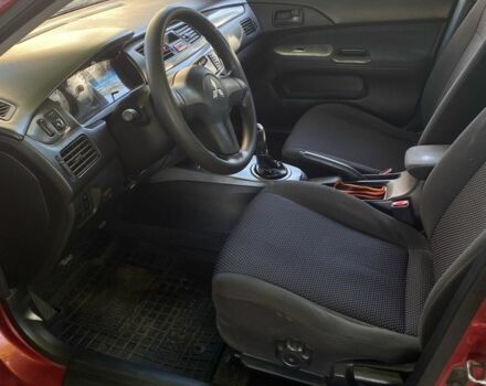 Красный Мицубиси Лансер, объемом двигателя 1.6 л и пробегом 277 тыс. км за 3299 $, фото 3 на Automoto.ua