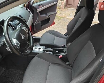 Красный Мицубиси Лансер, объемом двигателя 2 л и пробегом 186 тыс. км за 5600 $, фото 16 на Automoto.ua