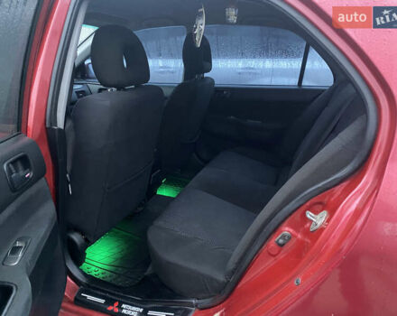 Красный Мицубиси Лансер, объемом двигателя 1.58 л и пробегом 269 тыс. км за 3899 $, фото 5 на Automoto.ua