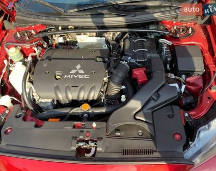 Красный Мицубиси Лансер, объемом двигателя 2 л и пробегом 66 тыс. км за 10000 $, фото 7 на Automoto.ua