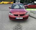 Красный Мицубиси Лансер, объемом двигателя 1.6 л и пробегом 380 тыс. км за 4000 $, фото 1 на Automoto.ua