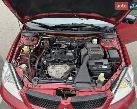 Красный Мицубиси Лансер, объемом двигателя 1.58 л и пробегом 285 тыс. км за 3650 $, фото 15 на Automoto.ua