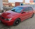 Красный Мицубиси Лансер, объемом двигателя 1.58 л и пробегом 300 тыс. км за 4300 $, фото 1 на Automoto.ua