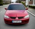 Червоний Міцубісі Lancer, об'ємом двигуна 1.6 л та пробігом 262 тис. км за 4699 $, фото 1 на Automoto.ua