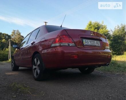 Червоний Міцубісі Lancer, об'ємом двигуна 1.6 л та пробігом 173 тис. км за 5500 $, фото 13 на Automoto.ua