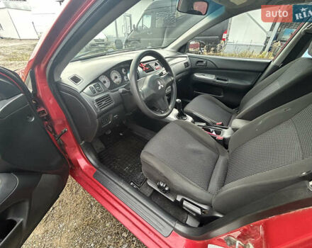 Красный Мицубиси Лансер, объемом двигателя 1.58 л и пробегом 280 тыс. км за 3250 $, фото 9 на Automoto.ua