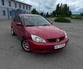 Червоний Міцубісі Lancer, об'ємом двигуна 1.6 л та пробігом 210 тис. км за 3499 $, фото 1 на Automoto.ua