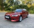 Червоний Міцубісі Lancer, об'ємом двигуна 2 л та пробігом 150 тис. км за 6700 $, фото 1 на Automoto.ua