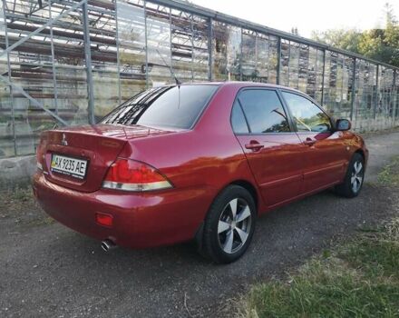 Червоний Міцубісі Lancer, об'ємом двигуна 1.6 л та пробігом 173 тис. км за 5500 $, фото 21 на Automoto.ua