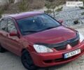 Красный Мицубиси Лансер, объемом двигателя 1.6 л и пробегом 242 тыс. км за 4999 $, фото 1 на Automoto.ua