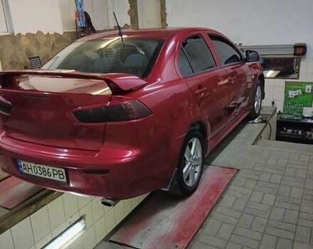 Червоний Міцубісі Lancer, об'ємом двигуна 2 л та пробігом 240 тис. км за 6300 $, фото 7 на Automoto.ua